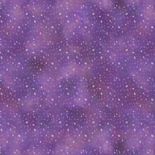 Windham Fabrics Violeta Whistler Studios Purple Speckle, a fabric with a purple background and scattered speckle pattern in various shades of purple and pink.