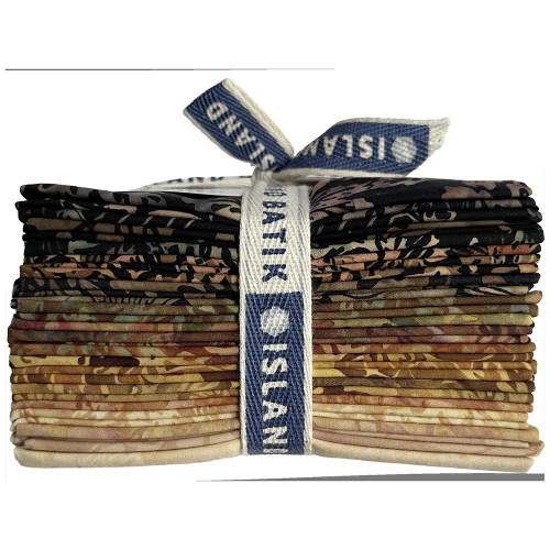 Lumin Fabrics Island Batik Woodland Warmth Batiks Fat Quarter Bundles, neatly stacked with a blue and white ribbon tied around them.