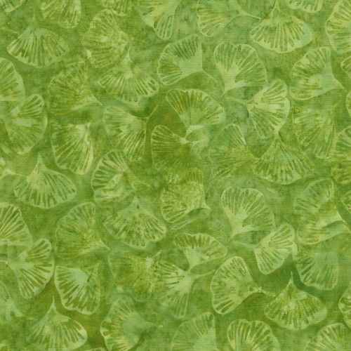 Lumin Fabrics Island Batik Sunflower Spice Batiks Tossed Petals Green Lemongrass, green batik fabric featuring a floral pattern of sunflower petals in various shades of green.