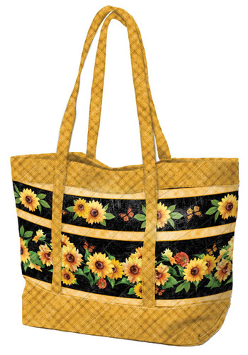 Wilmington Prints Sunshine Whispers Tote Quilt Kit, a large tote bag with sunflower and butterfly design on a black background, featuring yellow and black checkered fabric accents.