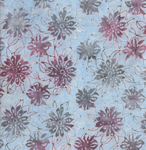 Timeless Treasures Fabrics Misty Beaches Tonga Batiks Floating Flowers Breeze Cream, fabric with a floral pattern of purple and gray flowers on a light blue background.