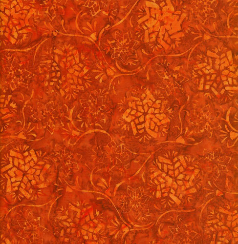 Timeless Treasures Fabrics Painted Canyon Tonga Batiks Fairytale Persimmon, orange fabric with a colorful floral pattern and abstract leaf designs.