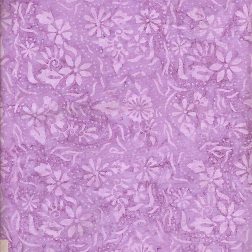 Timeless Treasures Fabrics Cosmic Tonga Batiks Pearled Floral Orchid Purple, close-up of purple batik fabric with pearl-like floral and leaf patterns.