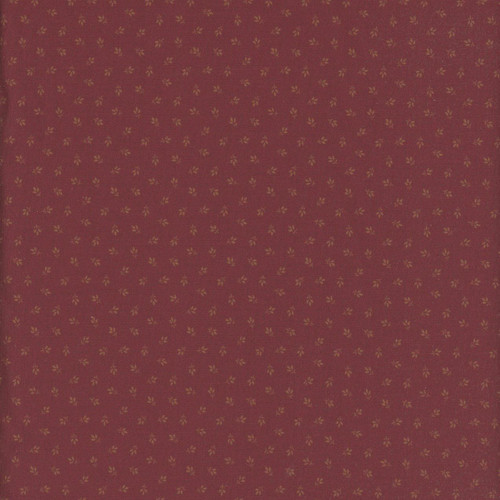 Marcus Fabrics Arabella Carrie Quinn Wine Tiny Tri-Leaf fabric, small gold leaf pattern on wine-colored background.