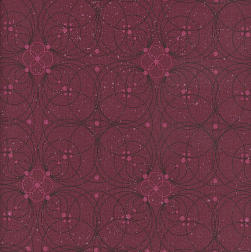 FreeSpirit Fabrics Enrapture by Guicy Guice Flourish Garnet, textile with intricate floral and circular design in pink and black on a garnet background.