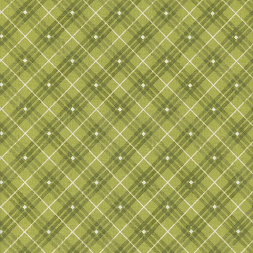 Henry Glass Fabrics Leanne Anderson Basics Green Bias Plaid, close-up of green plaid fabric with white diamond accents and diagonal lines.