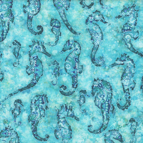 Quilting Treasures Dan Morris Oceana Aqua Seahorse, a fabric design featuring seahorse silhouettes with intricate patterns in shades of blue and aqua on a watercolor-style background.
