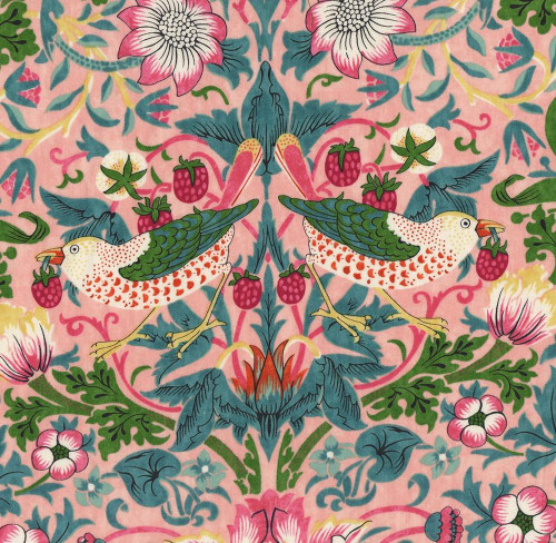 FreeSpirit Fabrics Bedford Park Cotton Lawn by William Morris Strawberry Thief Blush, fabric featuring a floral and bird pattern with strawberries, pink flowers, and green foliage on a pink background.
