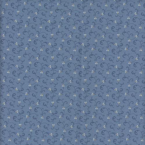 Marcus Fabrics Grace Elizabeth Carrie Quinn Swirl Blue, fabric with a blue background and a delicate swirling floral pattern with small white and yellow flowers.