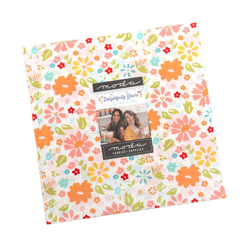 Moda Fabrics Delightfully Yours Sherri & Chelsi Layer Cake, colorful floral patterned fabric bundle with a label and photo of two women, for quilting and sewing projects.