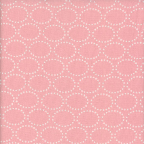 Blank Quilting Fabrics The Bright Side Jessica Dayon Light Pink Star Ovals, pink fabric with white star embellished oval pattern.
