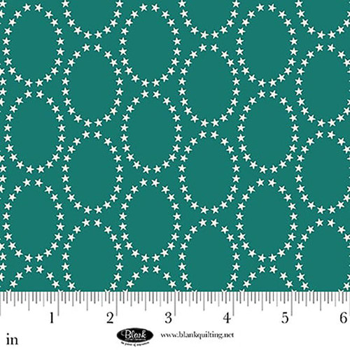 Blank Quilting Fabrics The Bright Side Jessica Dayon Turquoise Blue Star Ovals, turquoise fabric with white star oval pattern and a ruler at the bottom for size reference.