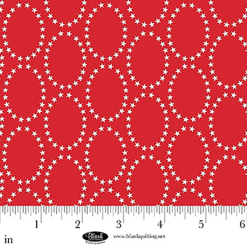 Blank Quilting Fabrics The Bright Side Jessica Dayon Red Star Ovals, red fabric with white star oval patterns, close-up view with measurement ruler.