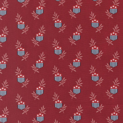 Moda Fabrics American Gatherings Primitive Gatherings Patriotic Star Shield Deep Crimson Red, patriotic fabric with shield pattern featuring stars and laurel branches on deep crimson background.