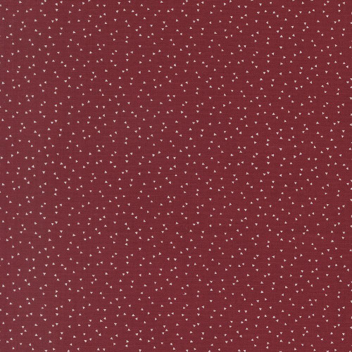 Moda Fabrics American Gatherings Primitive Gatherings Americana Confetti Deep Crimson Red, fabric with a deep crimson red background and small white triangular confetti patterns.