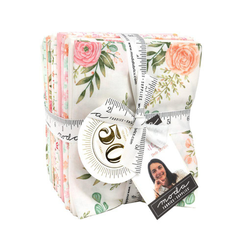 Moda Fabrics Kindness Deb Strain 27 Fat Quarters AB Bundle, folded fabric bundle with floral patterns and measuring tape tied around it.