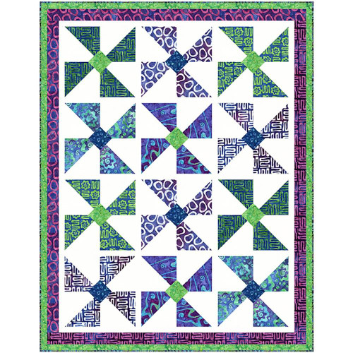 Riley Blake Fabrics Bold in Bloom Batiks Fran Morgan Bold In Bloom Quilt Kit, colorful quilt featuring geometric flower patterns in purple, blue, and green with a multicolored border.