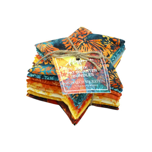 Hoffman Fabrics Bali Batik Hand Dyed Batik 17 Fat Quarters Monarch Orange Yellow Teal, colorful bundle of fabric squares with vibrant Batik designs and tied with twine.