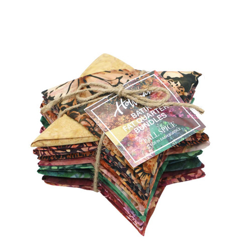 Hoffman Fabrics Bali Batik Hand Dyed Batik 18 Fat Quarters Brown Red Green, a bundle of colorful fabric packs with vibrant batik patterns tied with a string.