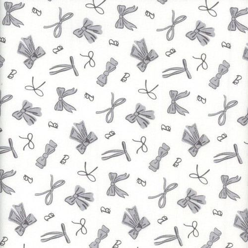 Riley Blake Barbie Vintage White B's and Bows fabric, black and white pattern featuring illustrations of bows and the letter B.
