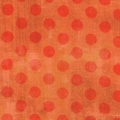 Moda BasicGrey Grunge Hits the Spot Papaya Orange fabric with orange polka dots pattern.