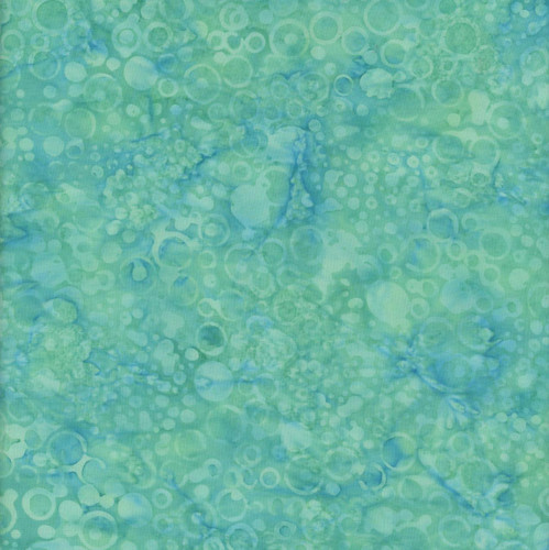 Windham Fabrics Anthology Batiks Mediterranean Sea Jacqueline de Jonge Teal Blue Green Circles, a vibrant batik fabric with circular patterns in shades of teal, blue, and green.