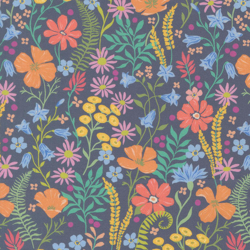 Moda Fabrics Cannon Beach Crystal Manning Dusk Blue Coastal Blooms Flowers, vibrant floral fabric design with orange, pink, purple, blue, and yellow flowers and green leaves on a dusk blue background.