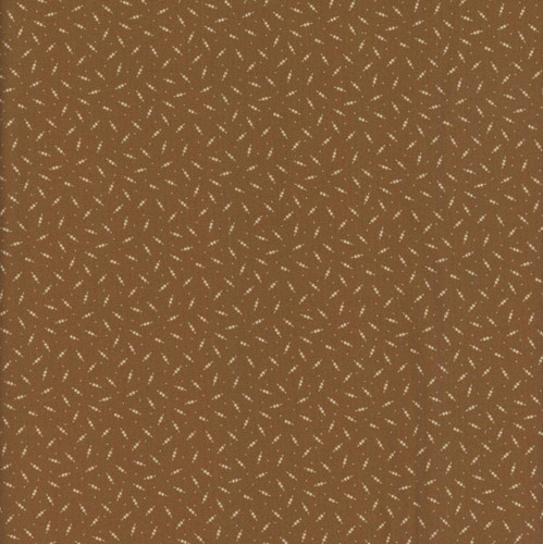 Marcus Fabrics Making Waves Katie Solberg Double Dots Gold, close-up of a fabric with a brown background and a pattern of gold double dots.