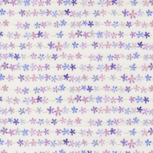 Moda Fabrics Delphinium Janet Clare Daisy Chain Floral Stripe Snowdrop, a fabric featuring a delicate pattern of small purple, pink, blue, and yellow flowers in a daisy chain floral stripe design on a white background.