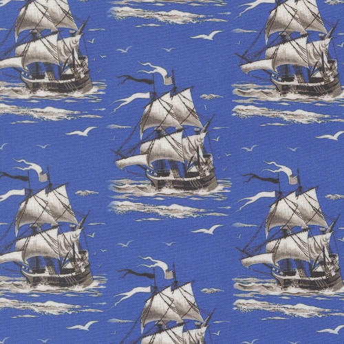 Moda Fabrics Saltwater Cathe Holden Smooth Sailing Ships Vintage Ocean Blue fabric, featuring a pattern of sailing ships, seagulls, and ocean waves on a blue background.