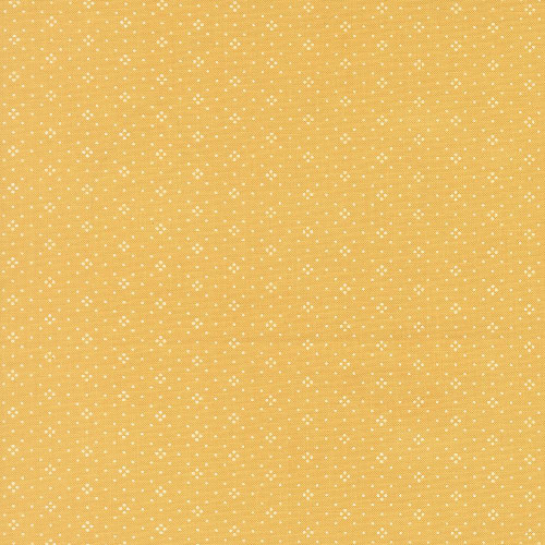 Moda Fabrics Summers End Fig Tree Co Sunflower Yellow Eyelet Basics, yellow fabric with small white eyelet floral pattern.