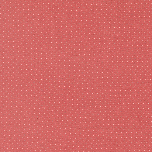 Moda Fabrics Fruit Salad Corey Yoder Pin Dot Flamingo Red, fabric with a coral pink background and small white polka dots.