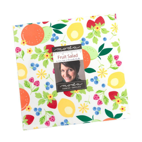 Moda Fabrics Fruit Salad Corey Yoder Ten Inch Squares Layer Cake, colorful fabric layer cake with a fruit salad pattern showing strawberries, blueberries, oranges, and yellow flowers.