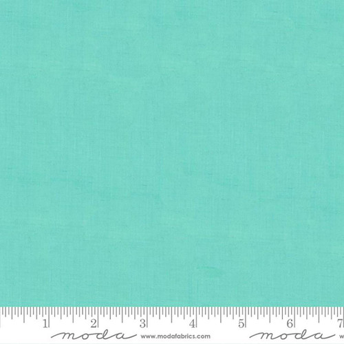 Moda Fabrics Crossweave Woven Seaglass Green, a close-up image of the woven fabric showing its crosshatch texture in a soothing sea glass green color.