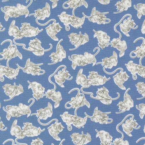Moda Fabrics A Cat Named Stitch Camille Roskelley Georgie Cats Kittens Blue, a fabric with a pattern of white kittens and cats on a blue background.