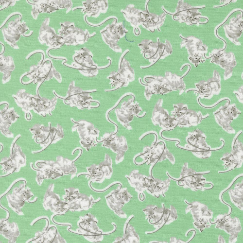 Moda Fabrics A Cat Named Stitch Camille Roskelley Georgie Cats Kittens Green fabric with white and gray cats playing and stretching on a light green background.