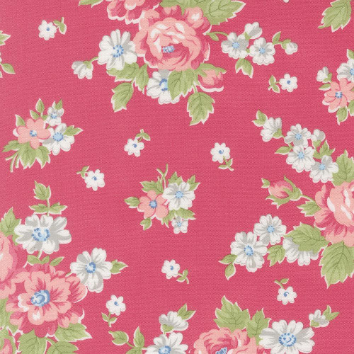 Moda Fabrics A Cat Named Stitch Camille Roskelley Cabbage Rose Floral Rosie Pink, close-up image of pink fabric with white and pink floral pattern and green leaves.