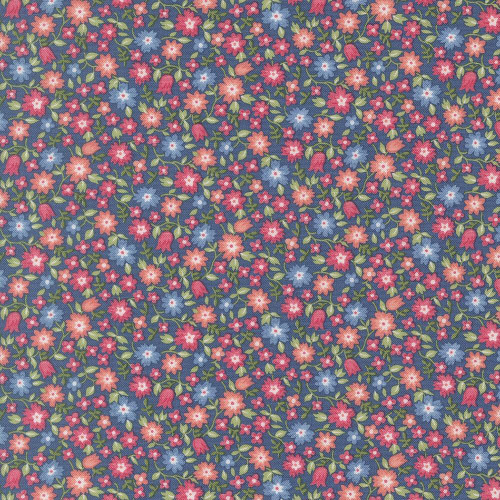 Moda Fabrics A Cat Named Stitch Camille Roskelley Lucky Small Floral Sea Blue, a fabric with a detailed pattern of small pink and blue flowers on a navy background.