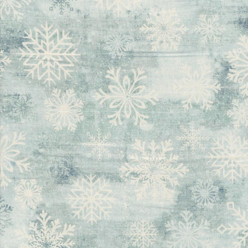 Studio E Fabrics Snowburst 108 Inch Wide Quilt Backing Snowflakes Breeze Blue, fabric featuring white snowflakes on a light blue background.