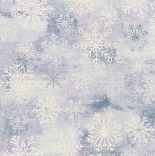 Studio E Fabrics Snowburst 108 Inch Wide Quilt Backing Snowflakes Enchanted Purple, close-up of fabric featuring white snowflake patterns on a purple and blue watercolor background, ideal for winter and holiday quilting projects.