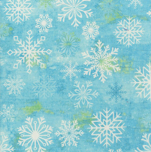 Studio E Fabrics Snowburst 108 Inch Wide Quilt Backing Snowflakes Caribbean Blue, fabric with white snowflakes and green accents on a blue background.