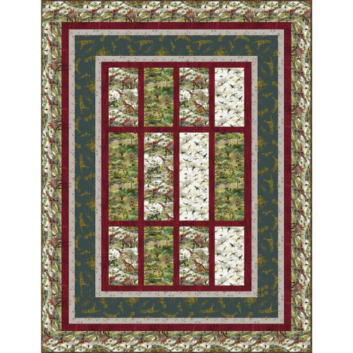Windham Fabrics Prehistoric Paradise Quiltasaurus Quilt Kit, colorful dinosaur-themed quilt with various dinosaur prints and multiple border patterns.