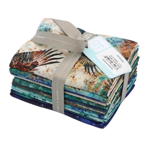 Quilting Treasures Fabrics Skyward Dan Morris 12 Fat Quarters, quilt fabric bundle with colorful, nature-inspired designs, neatly folded and tied with a gray ribbon.