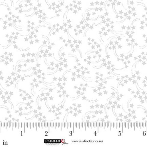 Studio E Fabrics Best of Cream and Sugar White on White Shooting Stars, white fabric with a pattern of white shooting stars and dotted trails, measuring approximately 6 inches across.