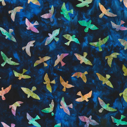 Robert Kaufman Fabrics Backyard Birds Artisan Batiks Evening Blue Birds in Flight, fabric with multicolored flying bird silhouettes on a dark blue background.