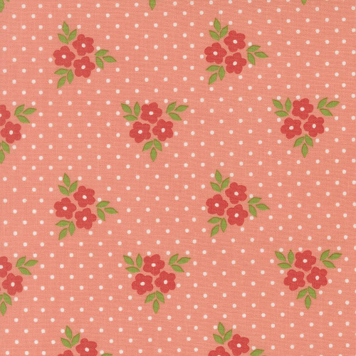 Moda Fabrics Poinsettia and Pear Sherri & Chelsi Bouquet Floral Carnation Pink, fabric with pink background floral pattern featuring clusters of red flowers and green leaves on a pink background with white polka dots.