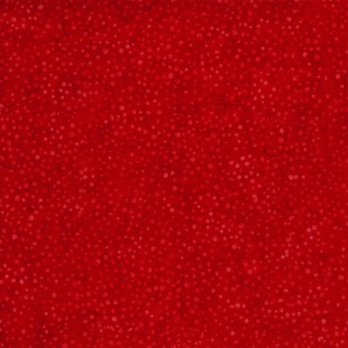 Timeless Treasures Fabrics Tonga Batiks Poinsettia Sprinkles Ruby Red, close-up of red batik fabric with small pink and red poinsettia sprinkle patterns.