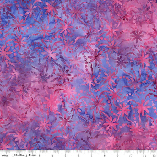 Riley Blake Fabrics 108 Inch Wide Batik Quilt Backing Vibrant Pointillism Splash of Grenadine Pink, colorful floral batik fabric with pink and purple hues and dotted patterns.