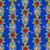 FreeSpirit Fabrics Riviera Odile Bailloeul Poolside Blue Floral Column Swimmers, vibrant floral pattern with hibiscus, plumeria, and berries on a blue wavy background, perfect for swimwear and summer fabrics.