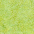 Lumin Fabrics Island Batik Posy Twist Batiks Small Petals Green Chartreuse, a vibrant green batik fabric with a pattern of small, twisting petal shapes.